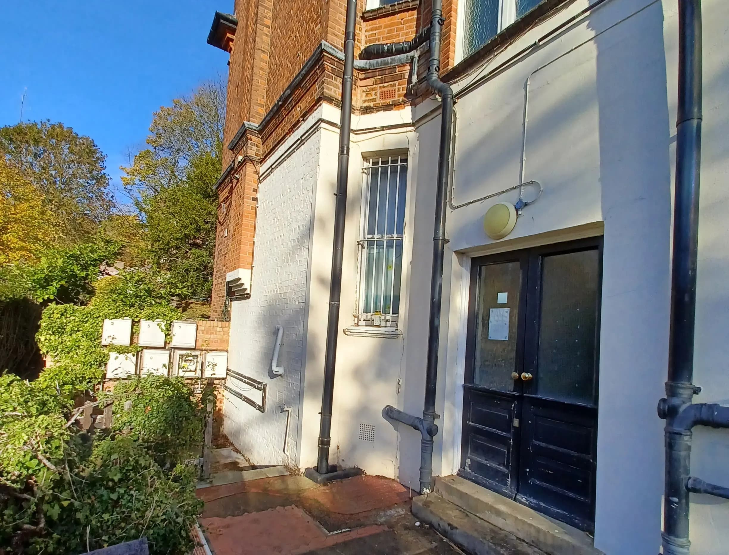 Side image of a doorway to building.