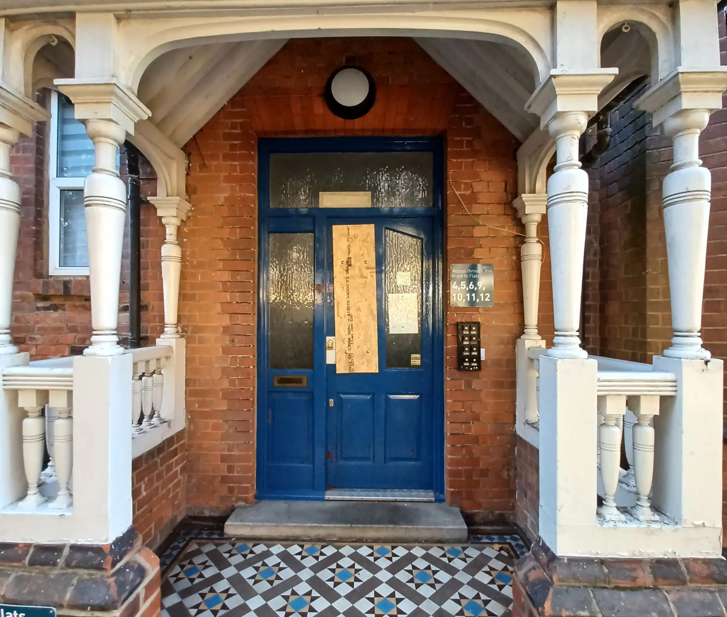 Image of a gated door entryway to the building.